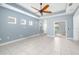 Bright living room with a ceiling fan, recessed lighting, and multiple windows providing natural light at 4162 Deep Creek Ter, Parrish, FL 34219