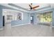 Open living area with tile flooring and view of the kitchen and pool at 4162 Deep Creek Ter, Parrish, FL 34219