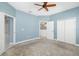 Spacious carpeted main bedroom with ceiling fan and en suite bathroom at 4162 Deep Creek Ter, Parrish, FL 34219