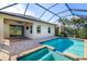 Relaxing screened-in pool area featuring a heated pool and integrated spa with brick trim at 4162 Deep Creek Ter, Parrish, FL 34219