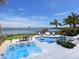 Resort-style backyard with pool, spa, and dock overlooking the tranquil bay waters at 424 Bowdoin Cir, Sarasota, FL 34236
