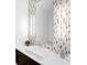 Bathroom features modern tile backsplash, floating vanity, and recessed lighting at 424 Bowdoin Cir, Sarasota, FL 34236