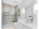 Bathroom features glass enclosed shower and white vanity at 424 Bowdoin Cir, Sarasota, FL 34236
