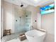 Stylish bathroom with freestanding tub and walk-in shower at 424 Bowdoin Cir, Sarasota, FL 34236