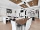 Open-concept kitchen with an island and bar seating, open dining area, and stainless steel appliances at 424 Bowdoin Cir, Sarasota, FL 34236