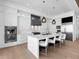 Gourmet kitchen with island seating, premium appliances, and ample counter space with modern hanging lights at 424 Bowdoin Cir, Sarasota, FL 34236