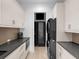 Bright laundry room features washer and dryer, countertop, and ample storage at 424 Bowdoin Cir, Sarasota, FL 34236