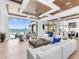 Bright and airy living room with floor-to-ceiling windows overlooking waterfront and modern decor at 424 Bowdoin Cir, Sarasota, FL 34236