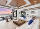 Bright and airy living room featuring modern furnishings, beautiful wood ceiling, and stunning waterfront views at 424 Bowdoin Cir, Sarasota, FL 34236