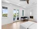 Bright main bedroom with desk area, balcony, and ensuite bathroom access at 424 Bowdoin Cir, Sarasota, FL 34236