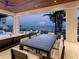 Stylish outdoor dining area with a waterfront view, ideal for elegant entertaining and casual meals at 424 Bowdoin Cir, Sarasota, FL 34236