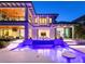 Luxurious backyard pool with illuminated steps and tiled accents, surrounded by a modern home at 424 Bowdoin Cir, Sarasota, FL 34236