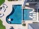 Aerial view of a modern pool with integrated lounge area and pristine tile surround at 424 Bowdoin Cir, Sarasota, FL 34236