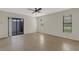 Empty bedroom with tile floor and a sliding glass door at 4463 Atwood Cay Pl # 22, Sarasota, FL 34233