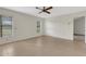 Bright bedroom featuring neutral walls, tile flooring, natural lighting and a ceiling fan at 4463 Atwood Cay Pl # 22, Sarasota, FL 34233