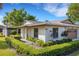 Inviting single-story home featuring manicured landscaping, a light-colored exterior, and a well-maintained roof at 4463 Atwood Cay Pl # 22, Sarasota, FL 34233