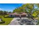 Charming home featuring a two-car garage and lush landscaping on a sunny day at 4463 Atwood Cay Pl # 22, Sarasota, FL 34233