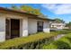 Charming single-story home entrance surrounded by manicured shrubs and mature landscaping at 4463 Atwood Cay Pl # 22, Sarasota, FL 34233