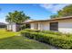 Well maintained front yard with beautiful green landscaping surrounding a charming single story home at 4463 Atwood Cay Pl # 22, Sarasota, FL 34233
