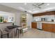 Bright kitchen with light wood floors, ceiling fan, and breakfast bar seating area at 4463 Atwood Cay Pl # 22, Sarasota, FL 34233