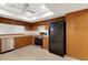 Bright kitchen with light floors, wood cabinets, stainless steel oven, dishwasher and black refrigerator at 4463 Atwood Cay Pl # 22, Sarasota, FL 34233