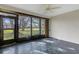Enclosed lanai with tile floor and a view of the lush backyard at 4463 Atwood Cay Pl # 22, Sarasota, FL 34233