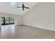 Spacious living room with vaulted ceilings and sliding glass doors to the outside at 4463 Atwood Cay Pl # 22, Sarasota, FL 34233