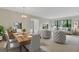 Staged dining and living room with modern furniture and stylish decor at 4463 Atwood Cay Pl # 22, Sarasota, FL 34233