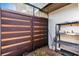 A secluded patio features horizontal wood paneling, a textured wall, and a useful storage rack at 4463 Atwood Cay Pl # 22, Sarasota, FL 34233
