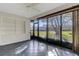 Enclosed sunroom features a ceiling fan, tile flooring and large windows with outdoor views at 4463 Atwood Cay Pl # 22, Sarasota, FL 34233