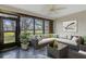 Beautiful, furnished sunroom featuring floor to ceiling windows and outdoor views at 4463 Atwood Cay Pl # 22, Sarasota, FL 34233