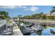 A private boat lift with a bench overlooking calm water, perfect for boating enthusiasts at 4741 Pinnacle Dr, Bradenton, FL 34208