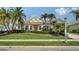 Inviting front exterior with well-maintained lawn, mature landscaping, and classic architectural details at 4741 Pinnacle Dr, Bradenton, FL 34208