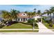Charming single-Gathering home with a manicured lawn, mature palms, and inviting curb appeal at 4741 Pinnacle Dr, Bradenton, FL 34208
