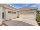 Attached two-car garage with brick-paved driveway, offering convenience and ample parking space at 4741 Pinnacle Dr, Bradenton, FL 34208