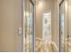 Hallway with mirrored sliding door closets looking into the main bathroom at 4741 Pinnacle Dr, Bradenton, FL 34208