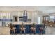 Gourmet kitchen featuring a large island with seating, stainless steel appliances, and custom cabinetry at 4741 Pinnacle Dr, Bradenton, FL 34208