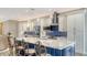 Bright kitchen showcasing a large island with a marble countertop and stainless steel appliances at 4741 Pinnacle Dr, Bradenton, FL 34208