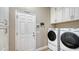 Well-equipped laundry room with modern washer and dryer and ample storage at 4741 Pinnacle Dr, Bradenton, FL 34208