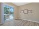 Bright living room with views of the screened-in patio and pool beyond at 4741 Pinnacle Dr, Bradenton, FL 34208