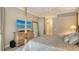 Bedroom featuring a four-poster bed, wooden dresser with television, and view to the outside at 4741 Pinnacle Dr, Bradenton, FL 34208