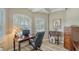Office with plantation shutters, wood floors, built-in storage, and a large desk at 4741 Pinnacle Dr, Bradenton, FL 34208