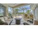 Inviting screened patio with comfortable seating, grill, and outdoor dining area at 4741 Pinnacle Dr, Bradenton, FL 34208