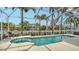 Beautiful pool with a spa surrounded by tropical landscaping in a screened enclosure at 4741 Pinnacle Dr, Bradenton, FL 34208