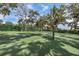 Well-maintained community tennis court surrounded by lush greenery, offering a recreational space for residents at 4741 Pinnacle Dr, Bradenton, FL 34208