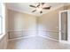 Bedroom with decorative trim and accents, with a ceiling fan and tile floors at 4915 Old Tree Pl, Sarasota, FL 34233