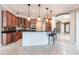 Open concept kitchen with dark granite countertops, bar seating, and stainless appliances at 4915 Old Tree Pl, Sarasota, FL 34233