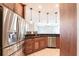 Gourmet kitchen features stainless steel appliances and custom cabinetry at 4915 Old Tree Pl, Sarasota, FL 34233