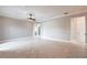 Expansive living space featuring neutral paint, tile flooring, ceiling fan and open layout for flexible use at 4915 Old Tree Pl, Sarasota, FL 34233