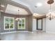Bright and spacious room featuring tray ceiling, recessed lighting, and windows bringing in great natural light at 4915 Old Tree Pl, Sarasota, FL 34233